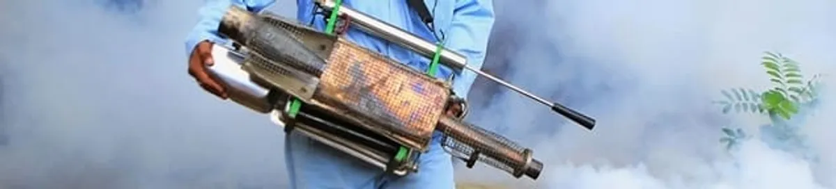 Fumigation technician using a fogger for deep pest treatment in Aurora, CO